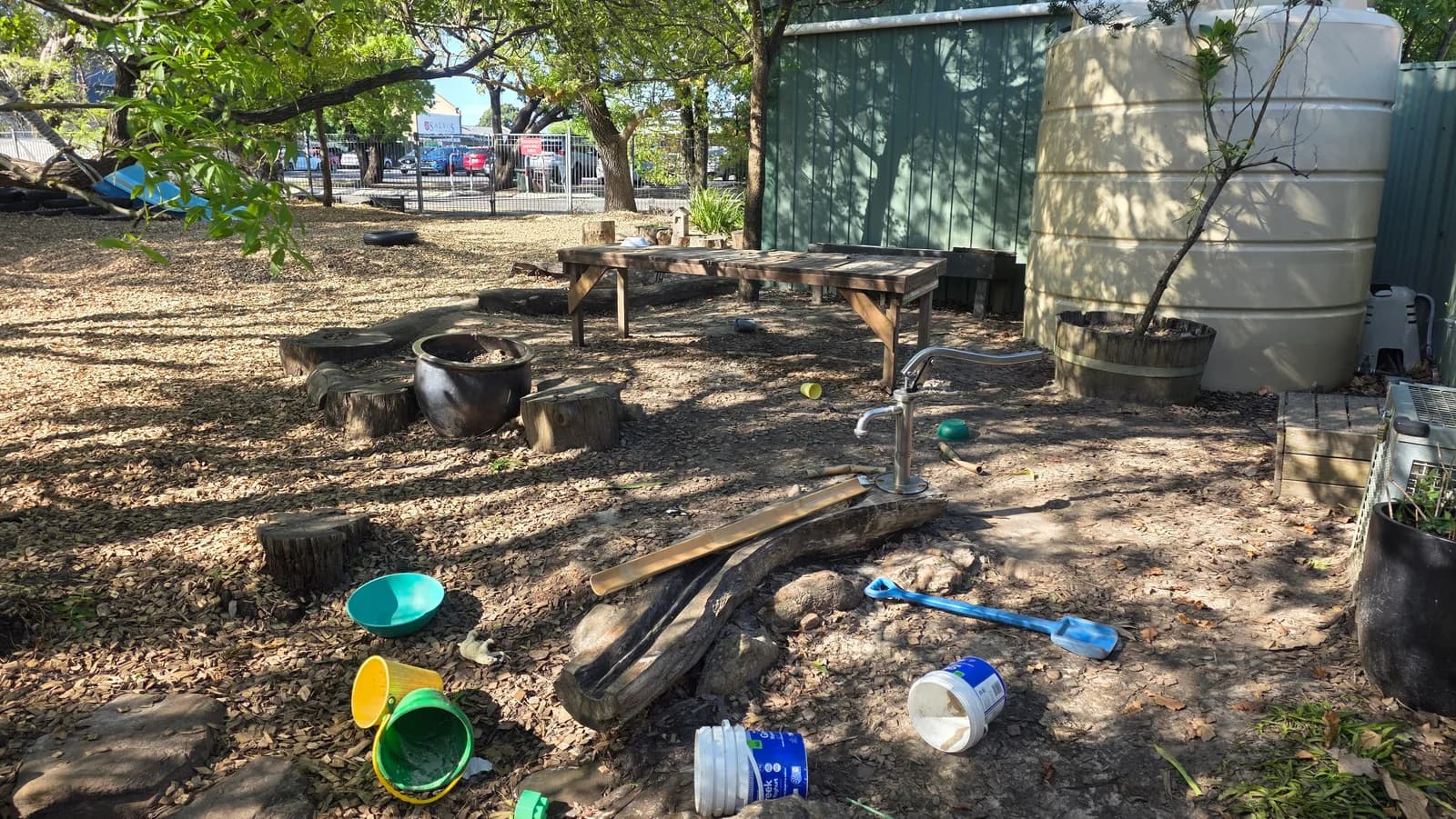 An outdoor water-play table and hand pump at Blackwood Community Child Care Centre