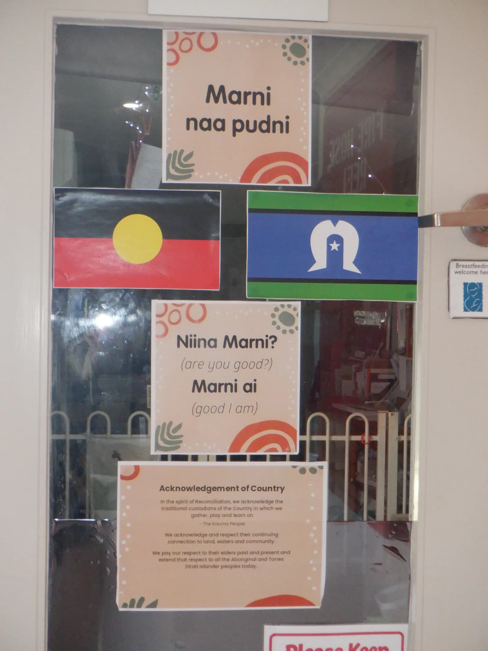 A decorated internal doorway with a welcome sign at the centre